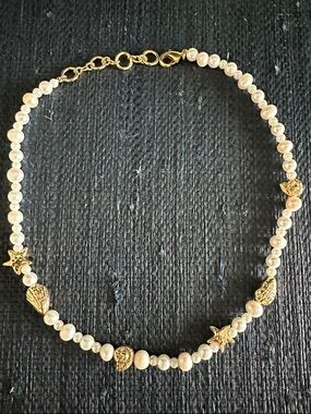 Pearl and gold charm necklace